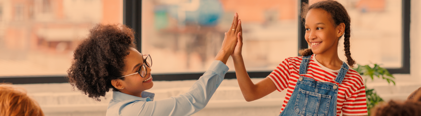 Teacher and child high five