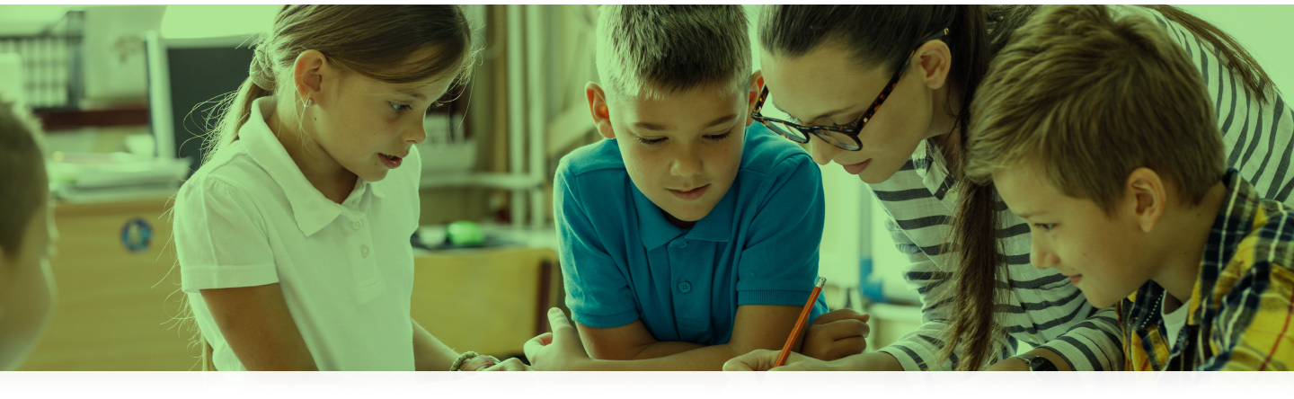 Teacher helping students