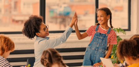 Teacher and child high five